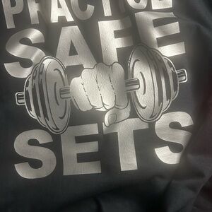 Black Graphic Tee with “Practice Safe Sets” Print